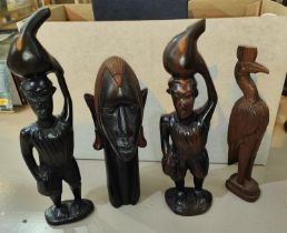 A group of four carved African figures various forms
