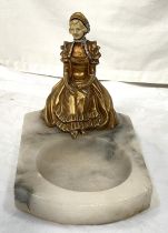 A 1920's polished marble dish with applied figure of a girl in Regency dress, 18cm