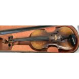 A late 19th/ early 20th century two piece back violin in hard case (splits to body)