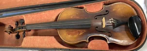 A late 19th/ early 20th century two piece back violin in hard case (splits to body)