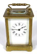 A 19th century French carriage clock with white dial and timepiece movement
