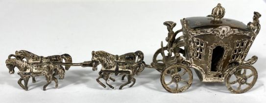 A miniature hall marked silver horse and carriage four horses and two coachmen L 15cm