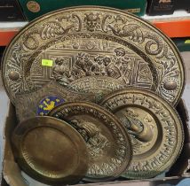 A good collection of brass traditional wall plaques, circular and shield shaped