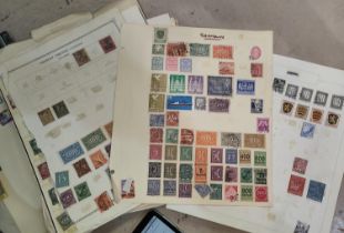 A collection of German stamps on sheets.
