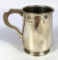 A hallmarked silver 1 pint mug of tapering cylindrical form, on raised foot, Birmingham 1932, 5oz