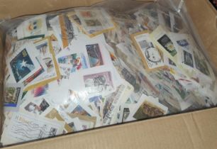 A box of 2.1kilo of close clipped foreign stamps