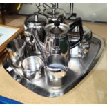 A stainless steel Sheffield Old Hall 7 piece tea set with tray and another.