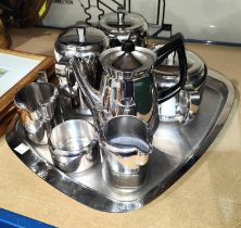 A stainless steel Sheffield Old Hall 7 piece tea set with tray and another.