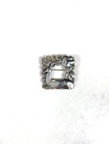 Georg Jensen:  a silver square brooch with doe and squirrel in foliage, stamped Georg Jensen