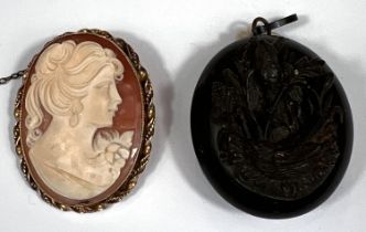 A 9ct gold framed cameo brooch with traditional female portrait, 11.7gm, a Whitby jet mourning