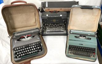 An Imperial model 60 typewriter and two cased travel typewriters