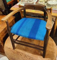 A 19th century child's tub shaped armchair in mahogany