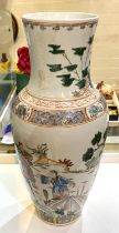 A large Chinese porcelain vase decorated with figures on horseback, plants and animals, height 37cm