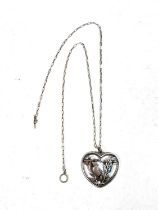 Georg Jensen:  a pierced silver heart shaped pendant, bird with outstretched wings perched in