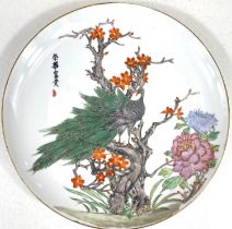 A 1950's Chinese plate decorated with hand painted birds and flowers, dia. 31cm