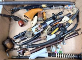 A collection of ceramic and other pipe parts, novelty revolver etc, German etc