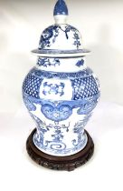 A Chinese blue and white baluster vase with lid, 50cm on stand