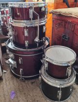 A part drum kit with 5 drums; a vintage radio and reel to reel player.