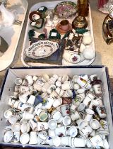 A selection of miniature china and malachite ornaments; a collection of china thimbles