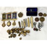 A collection of military buttons; badges; penknives; etc.