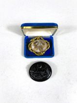 A yellow metal mourning brooch with leaf border, hair display, monogrammed reverse, length 5.5cm