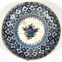 An Islamic Iznik style dish with blue decoration on white glaze, dia. 24.5cm