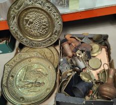 A large collection of copper plaques, traditional wall hanging and a large collection of brassware