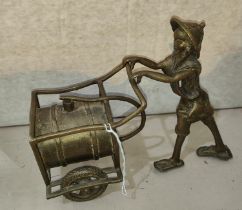 A Benin bronze figure of man pushing barrel on wheels, (from a private collection)