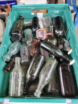 A collection of vintage advertising glass bottles etc.