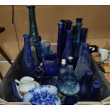 A collection of coloured bottles mainly Bristol blue etc