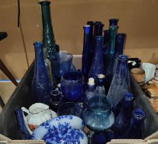 A collection of coloured bottles mainly Bristol blue etc