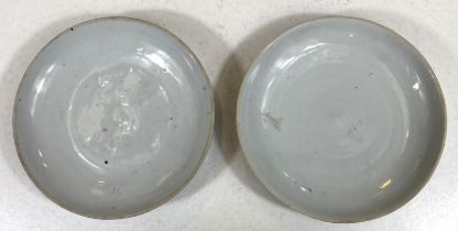 A pair of Chinese white glaze early antique plates, dia. 18cm