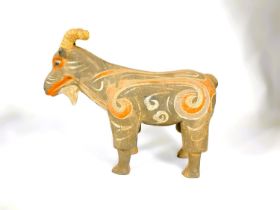 A Chinese under glazed pottery figure of a goat in the archaic style, painted decoration, 30cm high