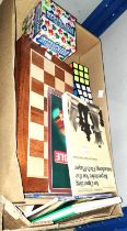 A folding chess board; a chess set formed from African heads; a chess clock; a Mah Jong set etc