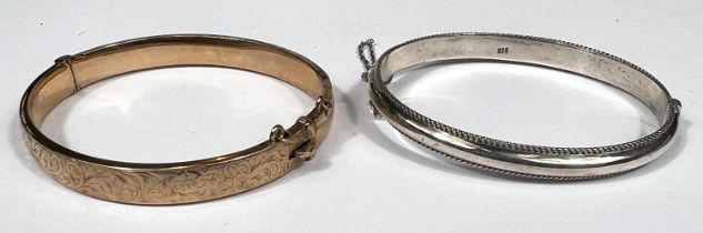 A 9ct gold bangle, 9.4oz and a white metal bangle stamped 925