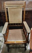 A 19th century American rocking chair in stained walnut