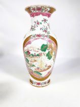A Chinese famille rose vase decorated with oval panels of boats, gilt and floral decoration, six