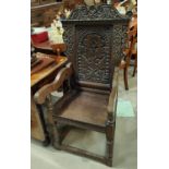 A 17th century style carved oak wainscot chair.