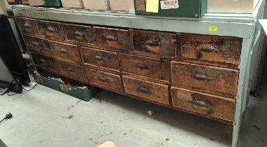 A Victorian pine large shops haberdashery cabinet with 16 drawers, ruler to the top, part painted,