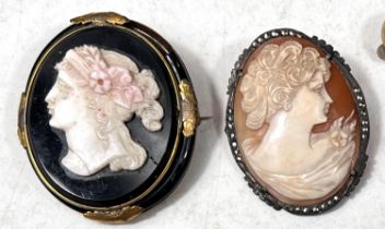 A classical head cameo brooch on a gilt and black background (a.f.) nother cameo brooch and a