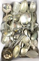 A hallmarked silver Art Nouveau strainer spoon, and Arts & Crafts hallmarked silver spoon with