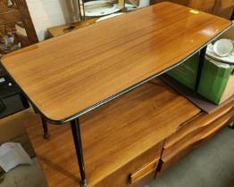 A mid 20th century rectangular shaped coffee table, high gloss finish on ebonised legs and a nest of