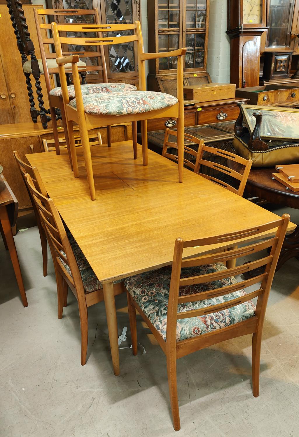 A 1970's G Plan style teak dining suite, comprising of a rectangular extendable table and 6
