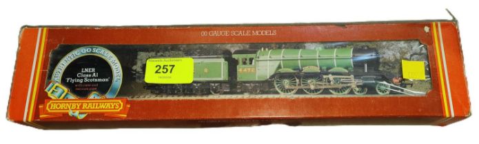 A boxed Hornby LNER Class A1 'Flying Scotsman' with crew and vacuum pipe.