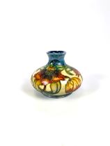 A modern Moorcroft vase of squat form, Anna Lily, monogrammed and with paper label, diameter 13cm (