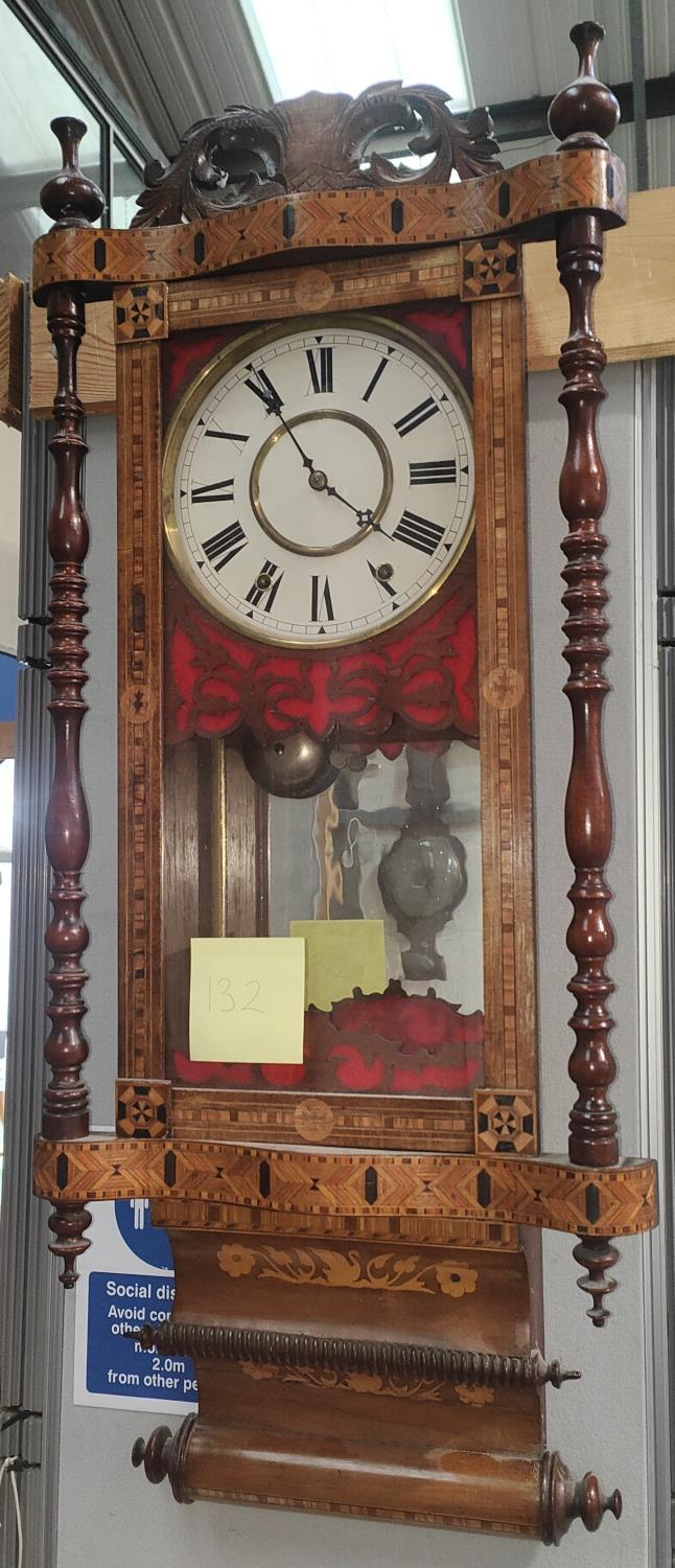 A 19th century American wall clock in Tunbridge inlaid case, with circular white dial, mirrored back