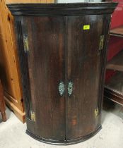 A Georgian oak wall hanging corner cupboard