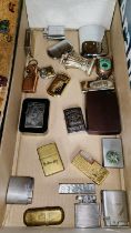 A Harley-Davidson cased zippo lighter, a jack Daniels zippo lighter and a collection of lighters