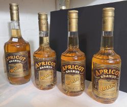 A 1 litre + 3, 50mm bottles of "Bolls Apricot Brandy".