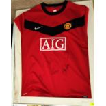 A Manchester United shirt, bearing signatures, other United items and a selection of prints and a